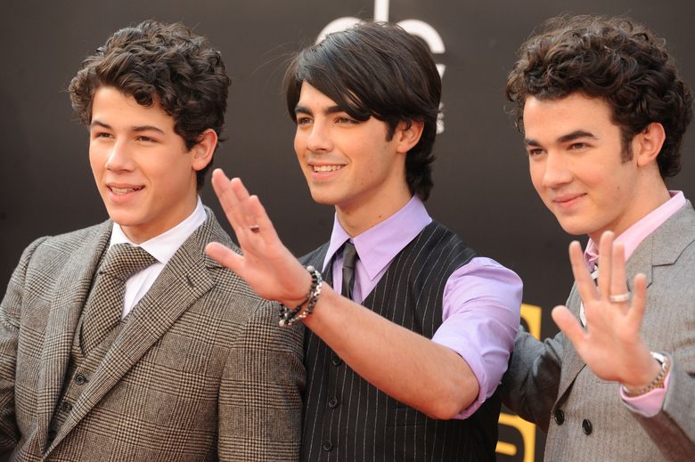 The Jonas Brothers, Nick Jonas, Joe Jonas and Kevin Jonas and little  brother Frankie Jonas The New York Premiere of the Disney Stock Photo -  Alamy