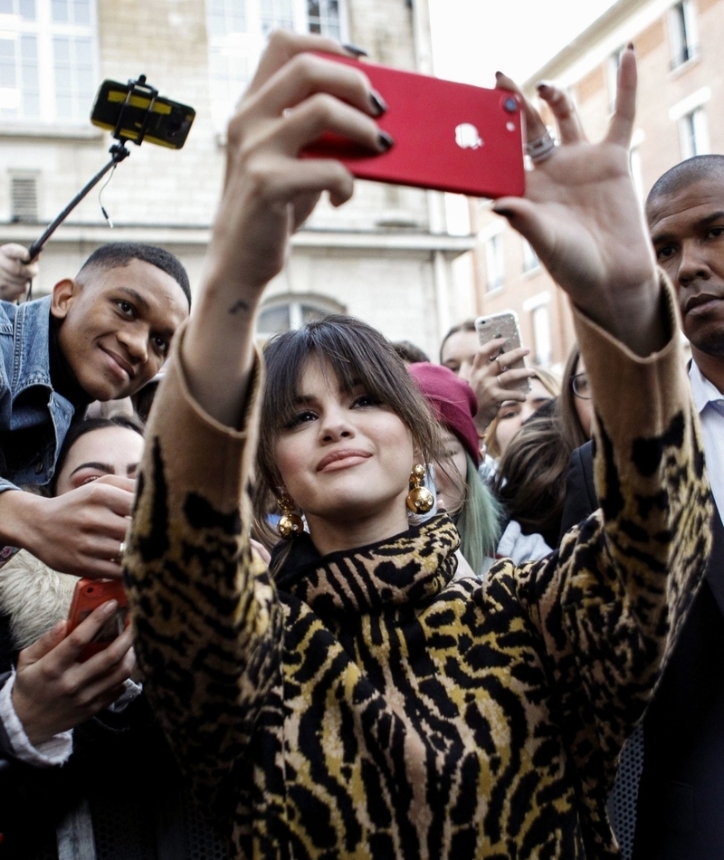 She Loves Her iPhone | Shutterstock Editorial Photo by Philippe Blet