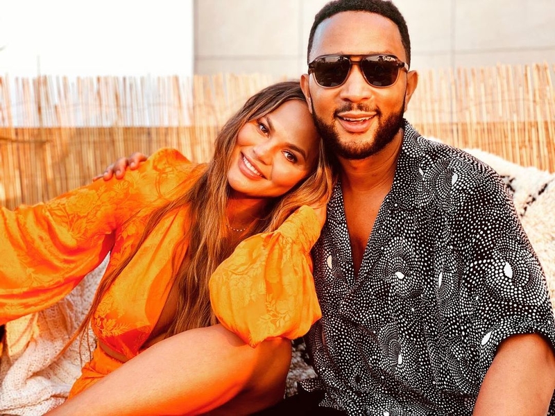 A Happy, Very Surprised Couple | Instagram/@chrissyteigen