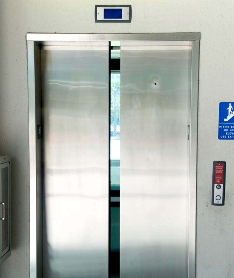 Hole on Elevator Doors | Alamy Stock Photo