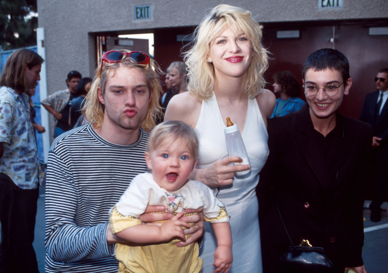 Cobain and Love With Their Mini-Me | Getty Images Photo by Kevin Mazur/WireImage